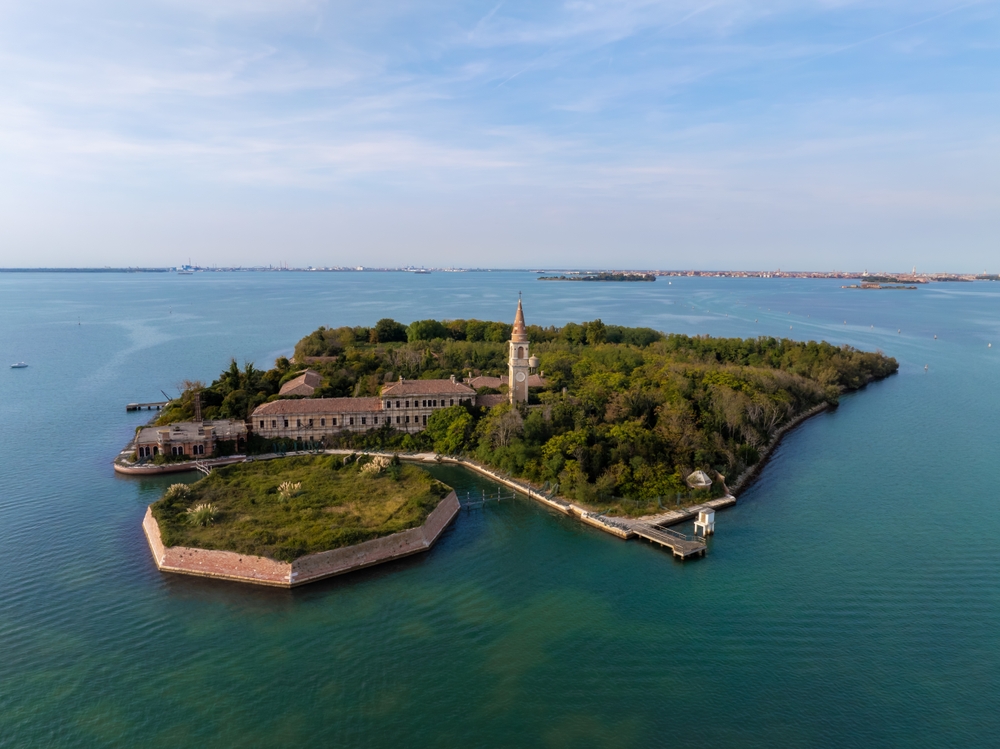 Aerial view of the plagued ghost island of Poveglia in the Venetian lagoon Venice, Italy
