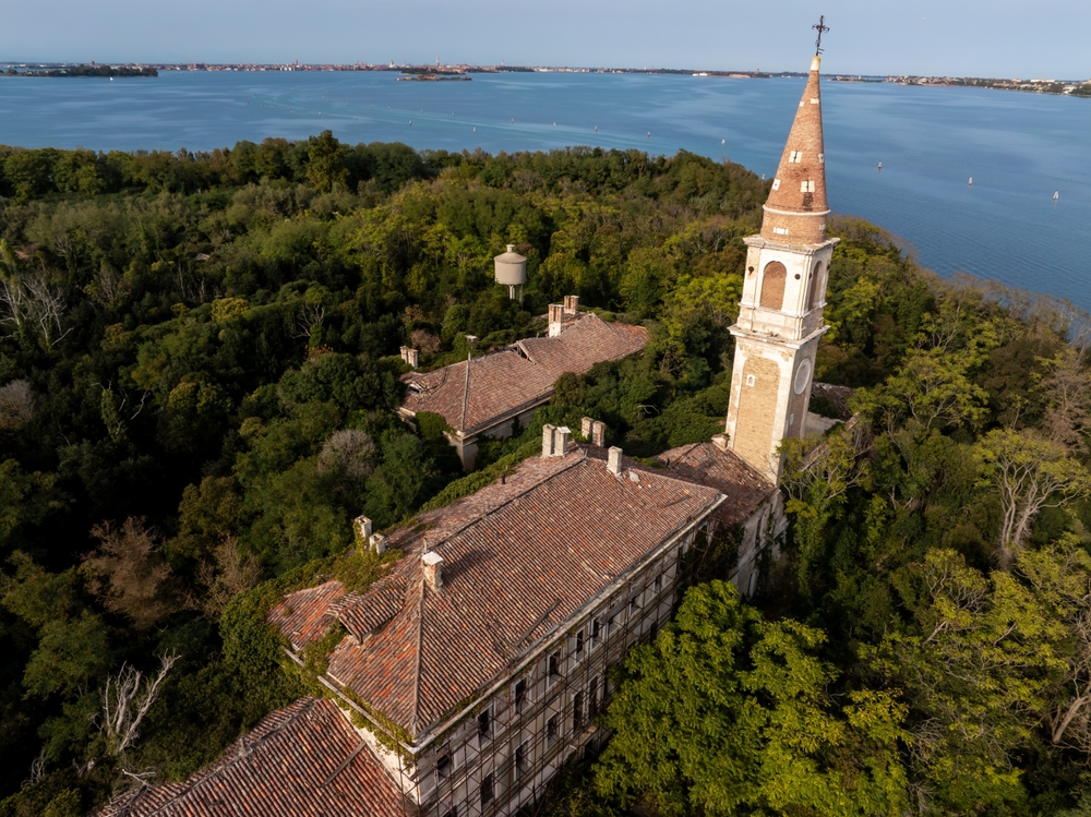 Aerial view of the plagued ghost island of Poveglia in the Venetian lagoon Venice, Italy