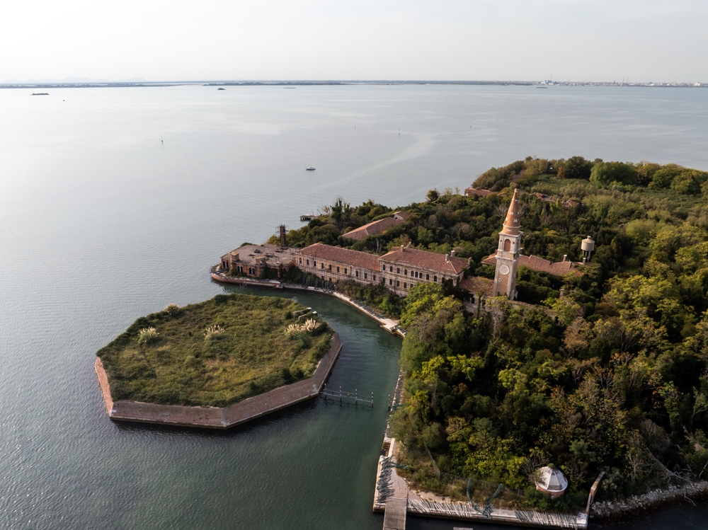 Aerial view of the plagued ghost island of Poveglia in the Venetian lagoon Venice, Italy