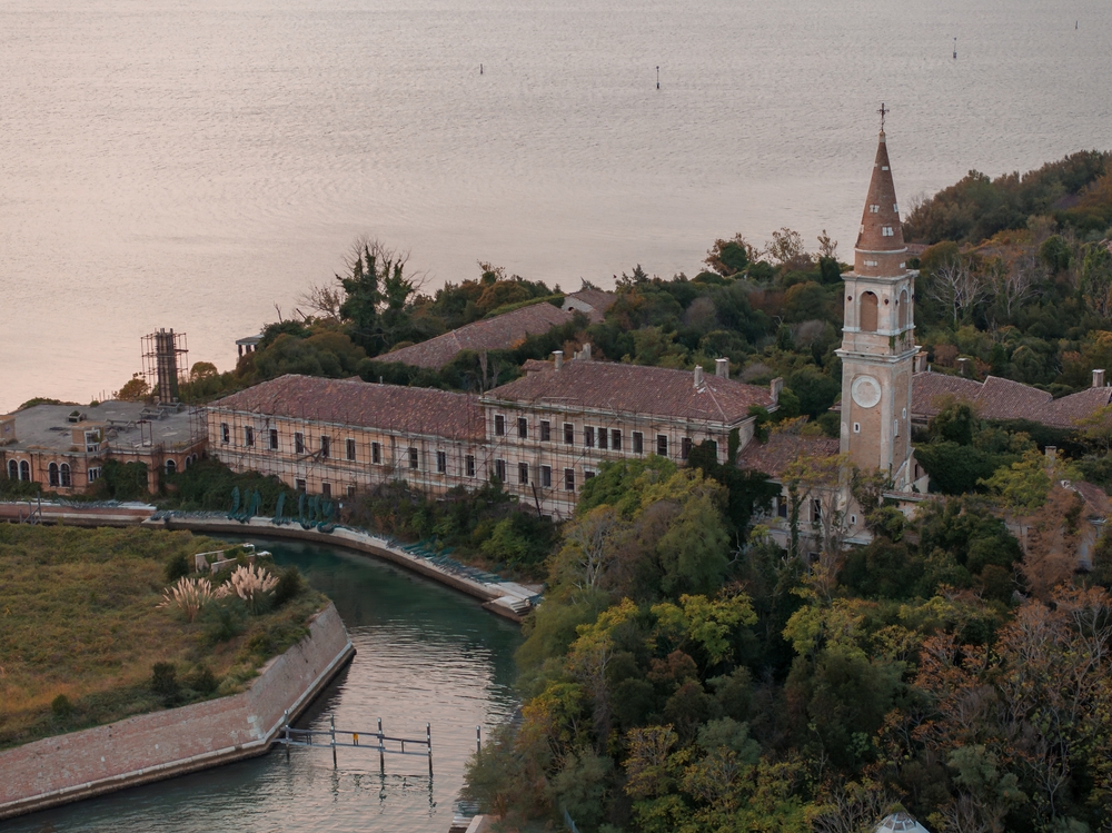 Aerial view of the plagued ghost island of Poveglia in the Venetian lagoon Venice, Italy