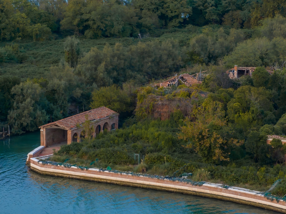 Aerial view of the plagued ghost island of Poveglia in the Venetian lagoon Venice, Italy