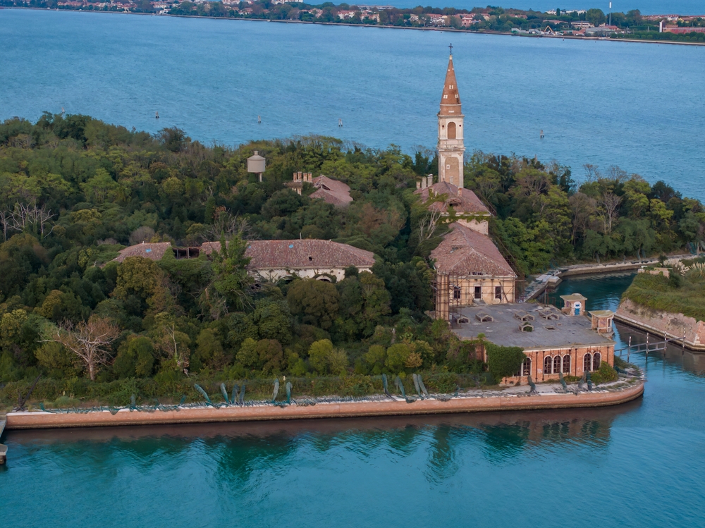Aerial view of the plagued ghost island of Poveglia in the Venetian lagoon Venice, Italy
