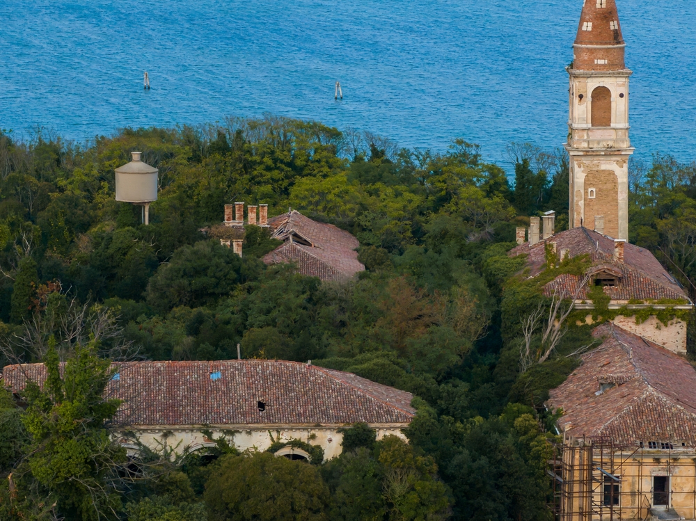 Aerial view of the plagued ghost island of Poveglia in the Venetian lagoon Venice, Italy