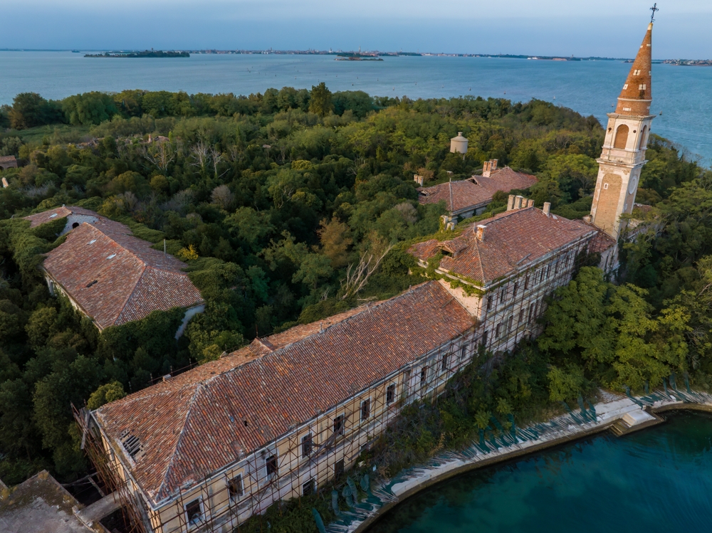 Aerial view of the plagued ghost island of Poveglia in the Venetian lagoon Venice, Italy