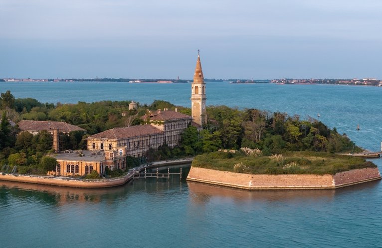 Aerial view of the plagued ghost island of Poveglia in the Venetian lagoon Venice, Italy