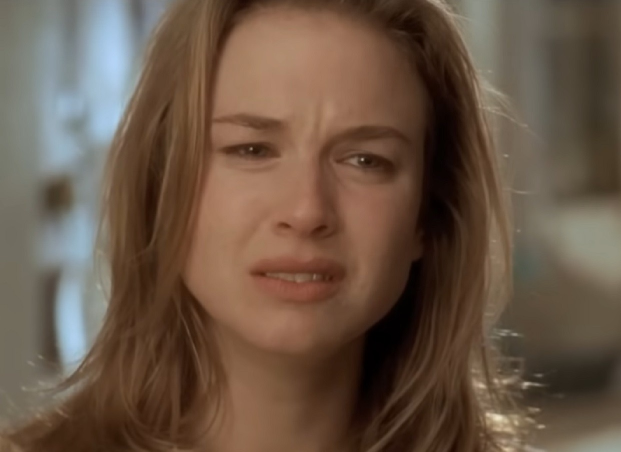 Screenshot of Carrie-Anne Moss looking upset - from The Matrix (1999)