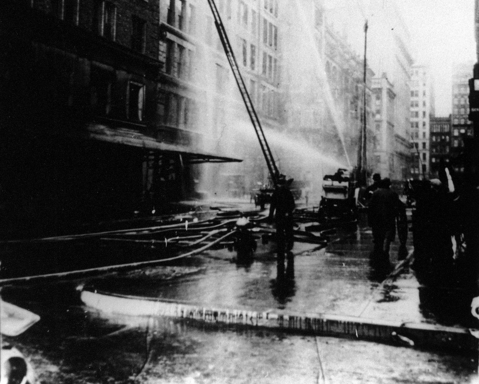 Firefighters Spray Water On The Asch Building Trying To Put Out The Triangle Factory Fire Blaze, March 25, 1911 (5279335917)