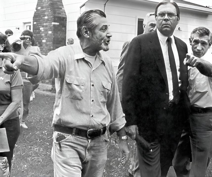 Grayscale Photo of Love Canal residents discuss revitalizing their contaminated neighborhood