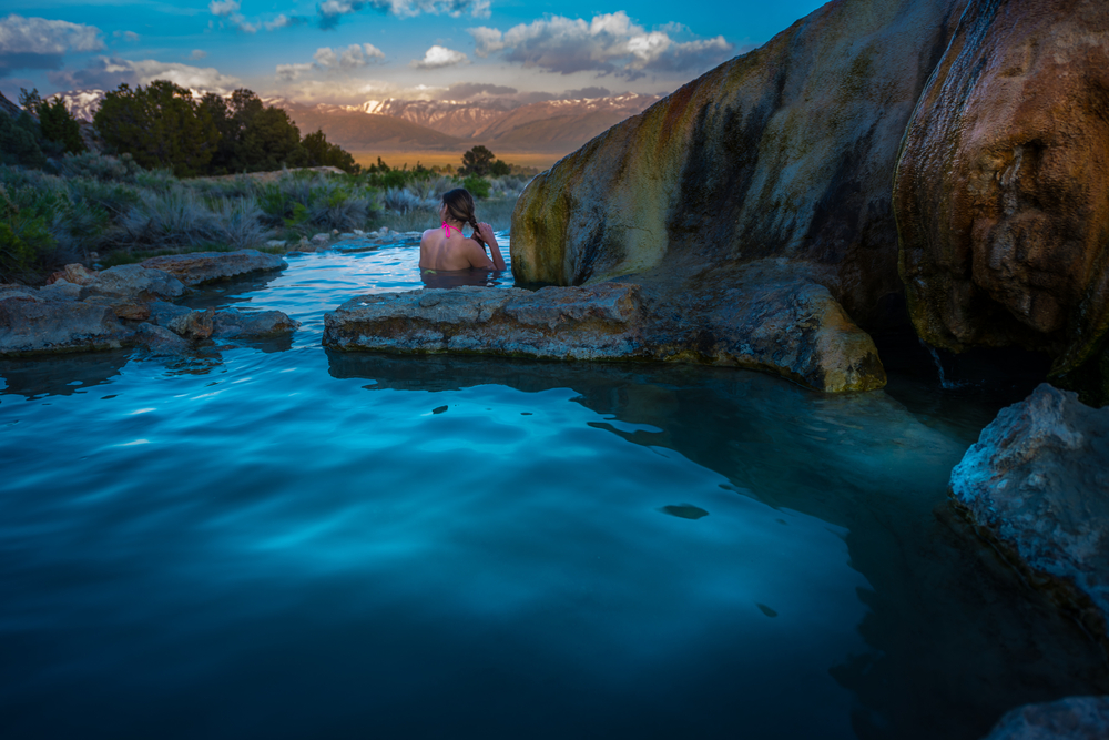 Woman relaxes in hot spring