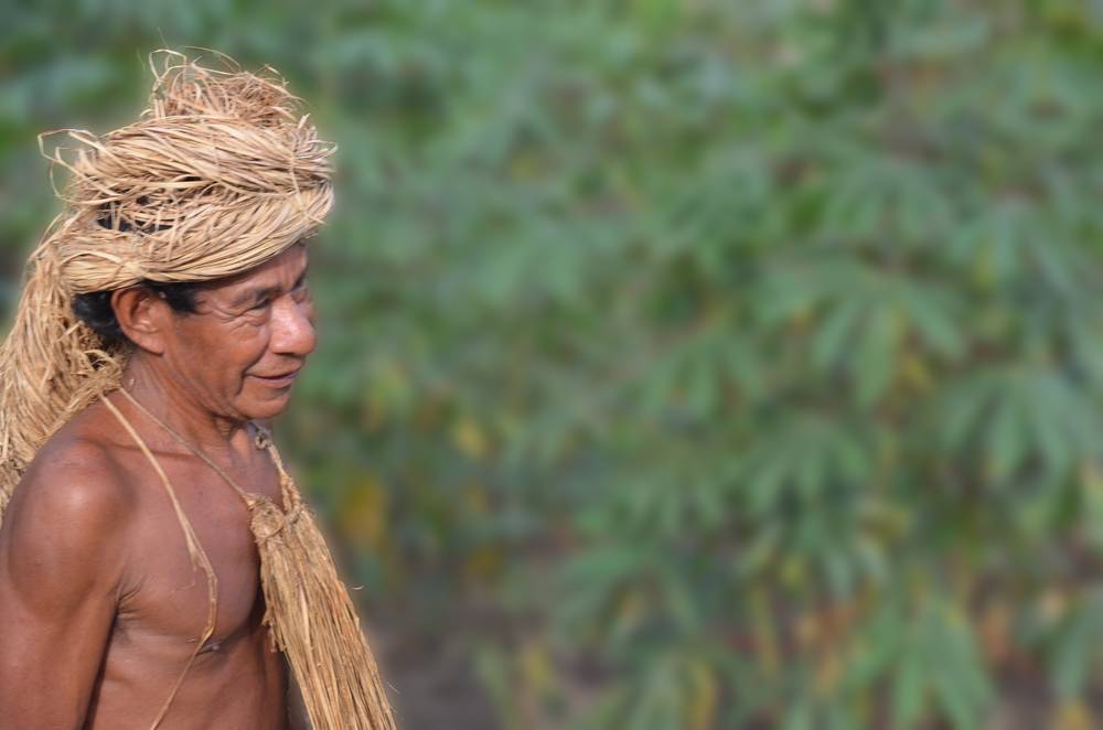 An elder member of the Yagua tribe wearing his traditional head dress