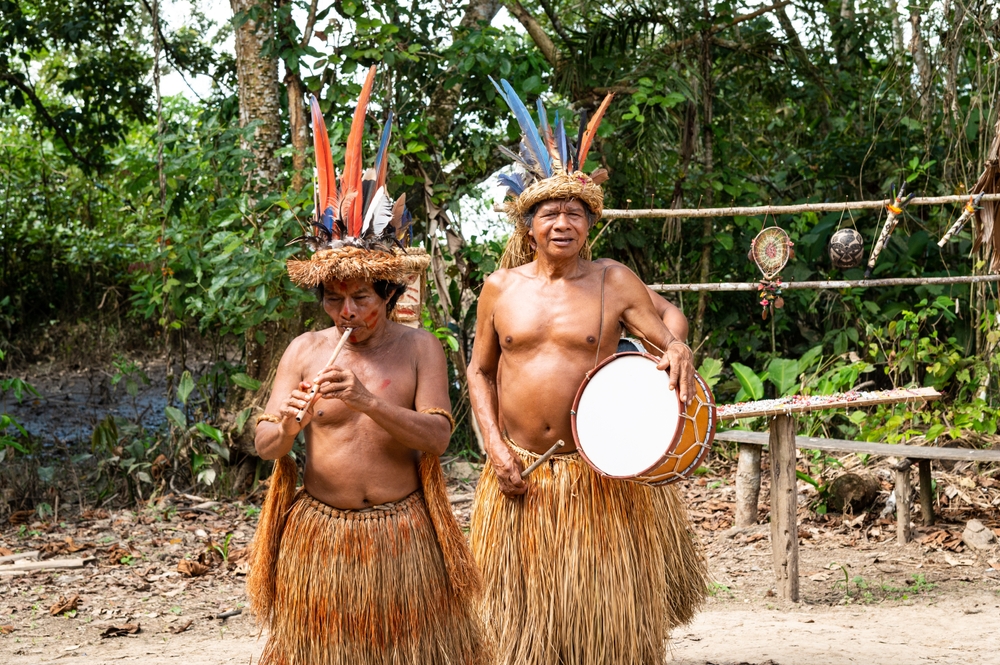 Photo of two Yaguas tribesmen playing instruments
