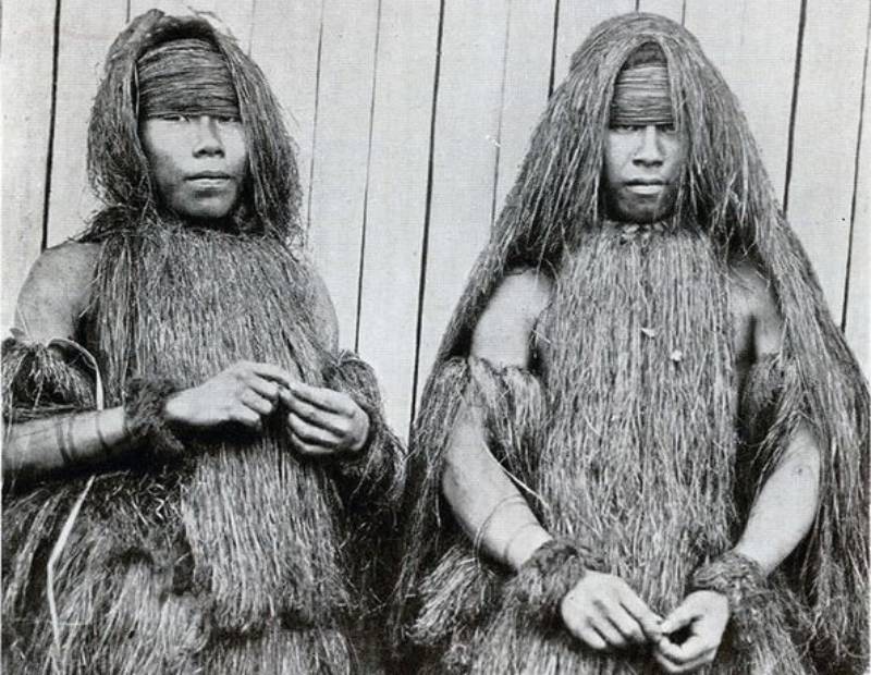 Yahua men in grass clothing