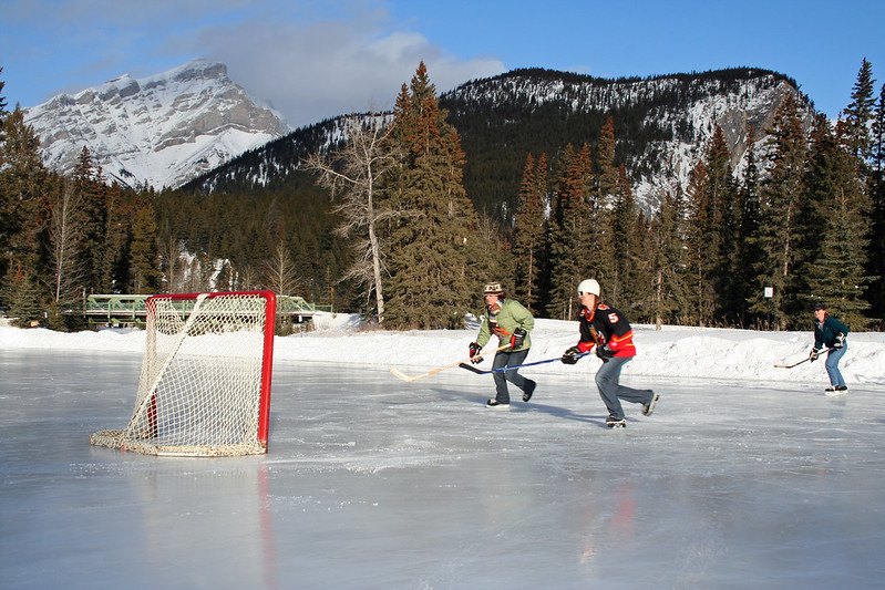 People Playing Pond Hockey at the Fairmont Banff Springs
