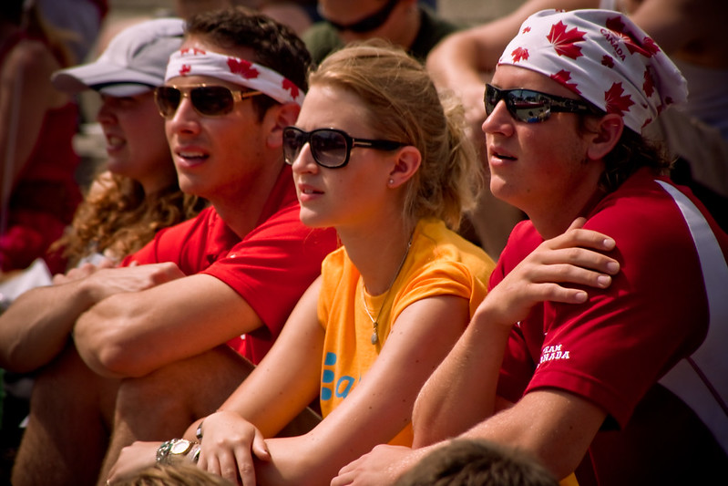 Pictures of people enjoying the Canada Day celebrations wearing Canadian jerseys and Canadian bandanas