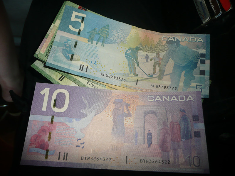Close-up Photo of Canadian Money placed on a table