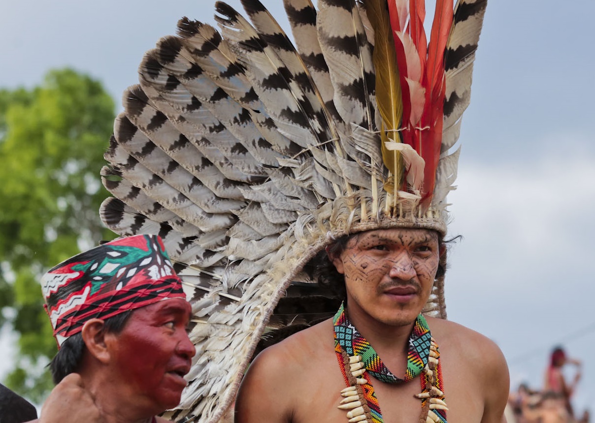 Taino Indigenous man with feather hat.