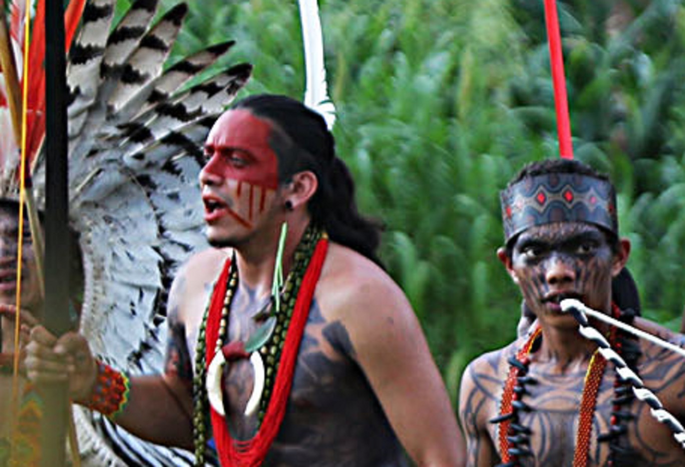 Taino Indians dancing outside.