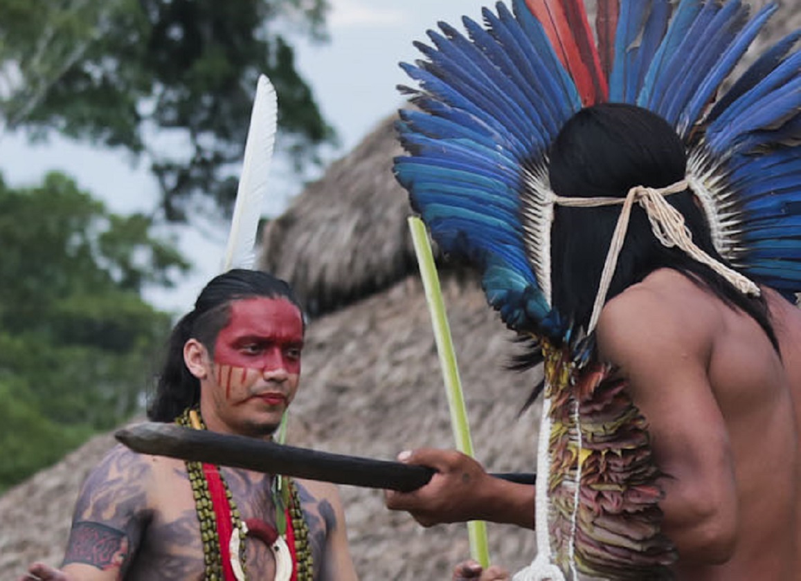 Taino Indigenous people dancing outside.