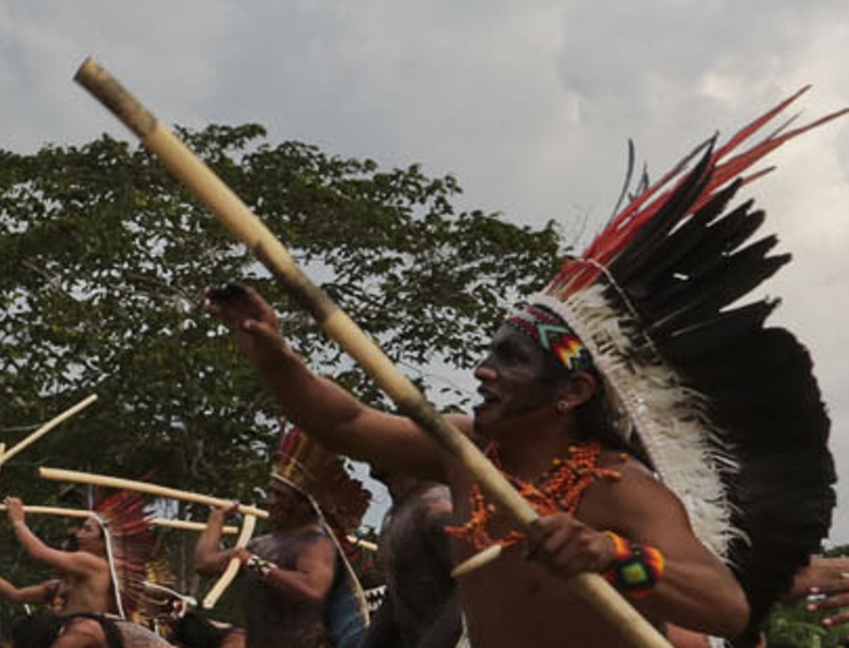 Taino Indigenous people dancing outside.