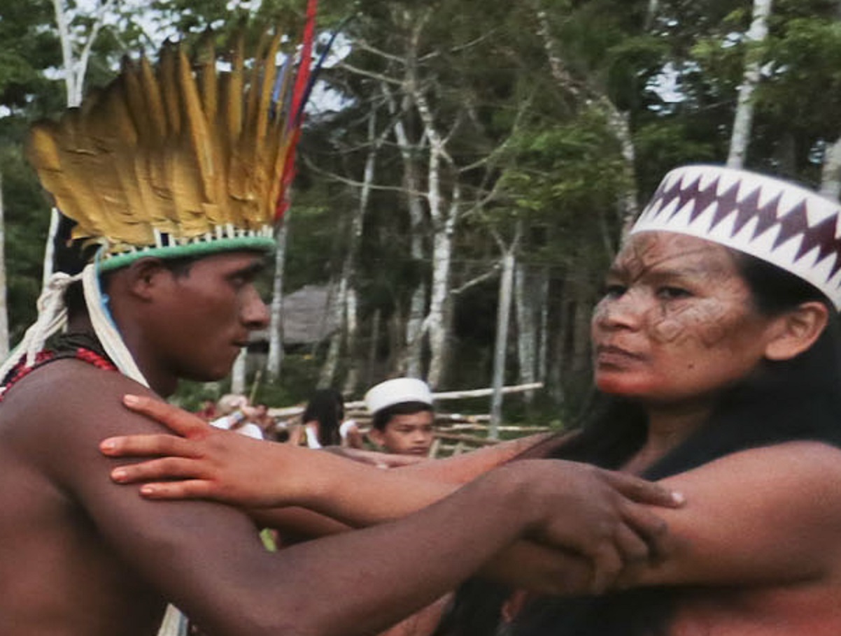 Taino Indian couple holding each other outside.