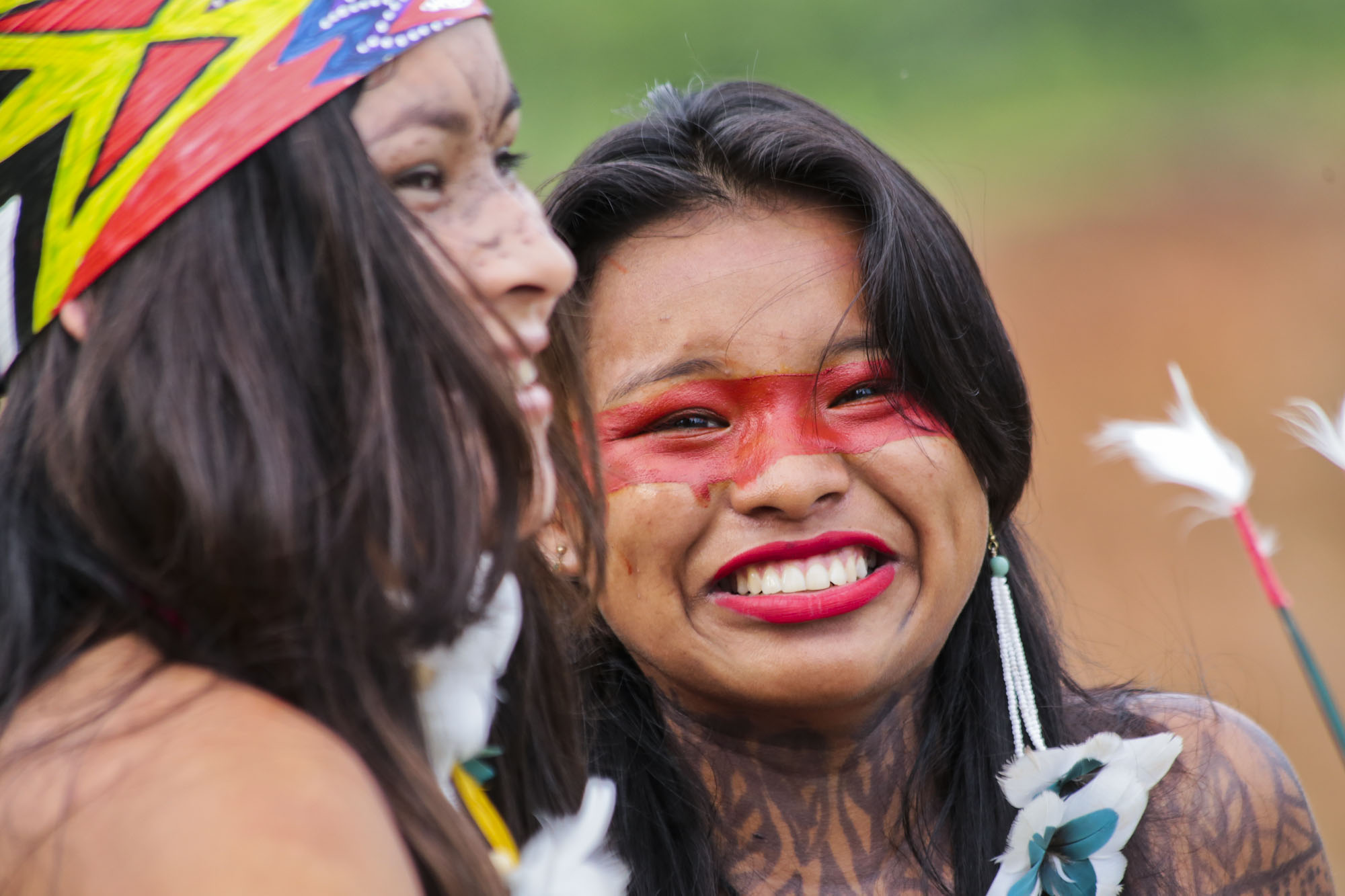 Taino Indian woman smiling outside.