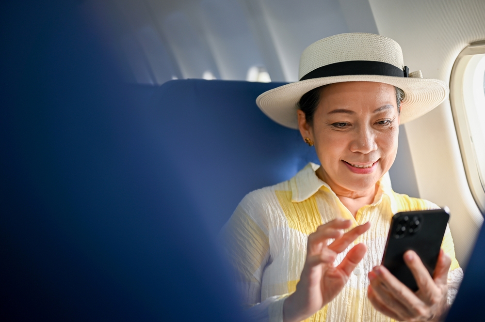 female passenger using her smartphone