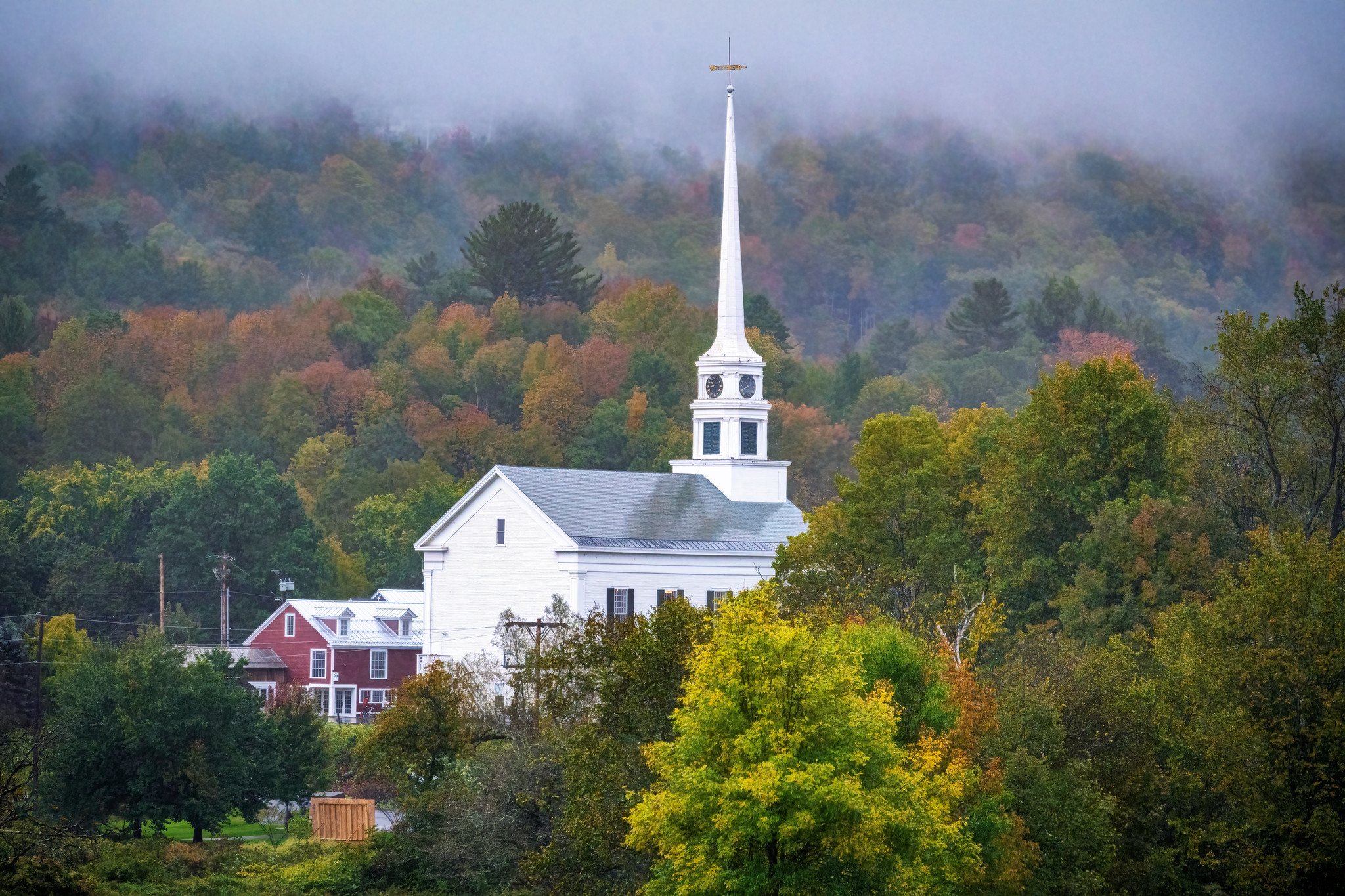 Church steeple in the rain in Stowe, Vermont - 2021