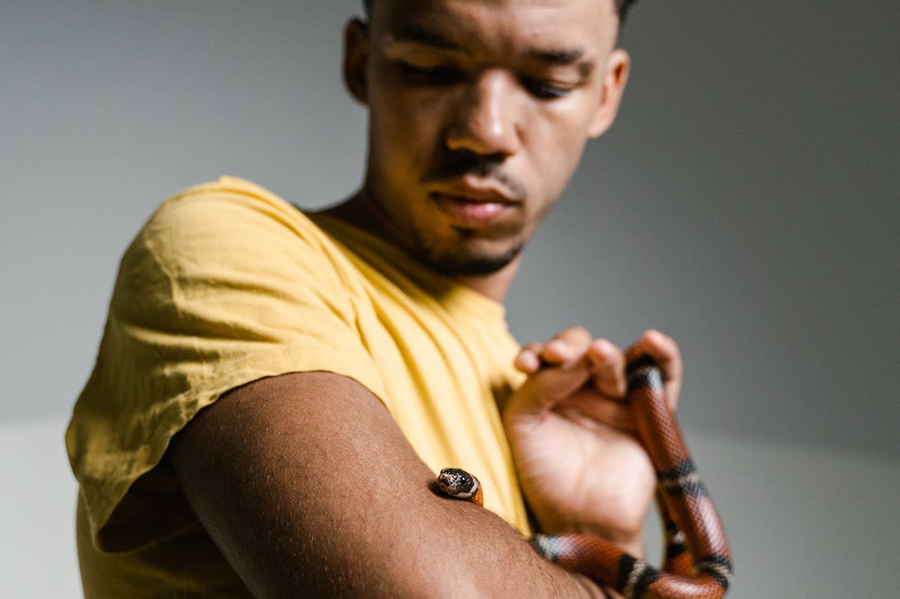 Man holding a snake.