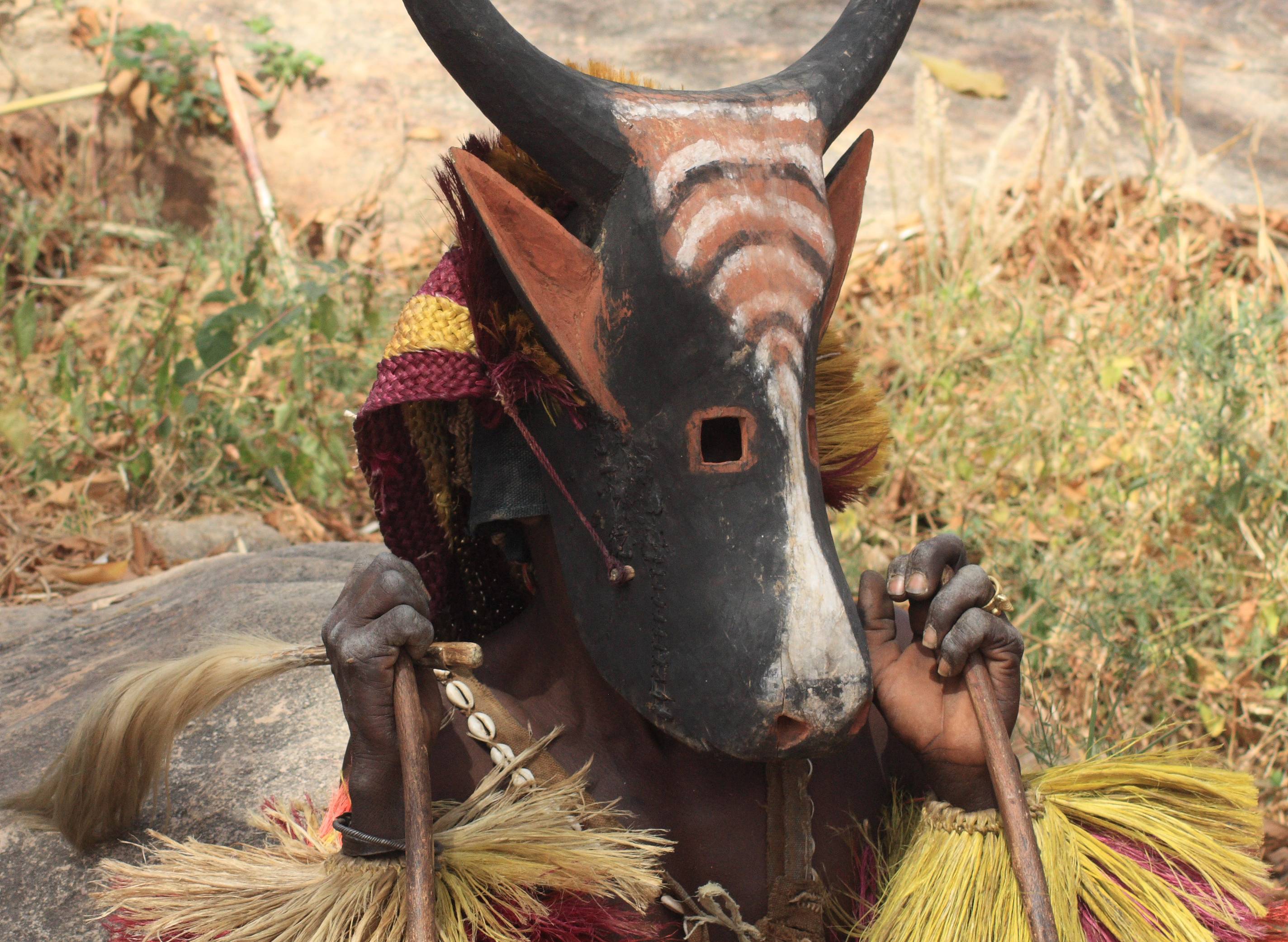Dogon man with his traditional mask