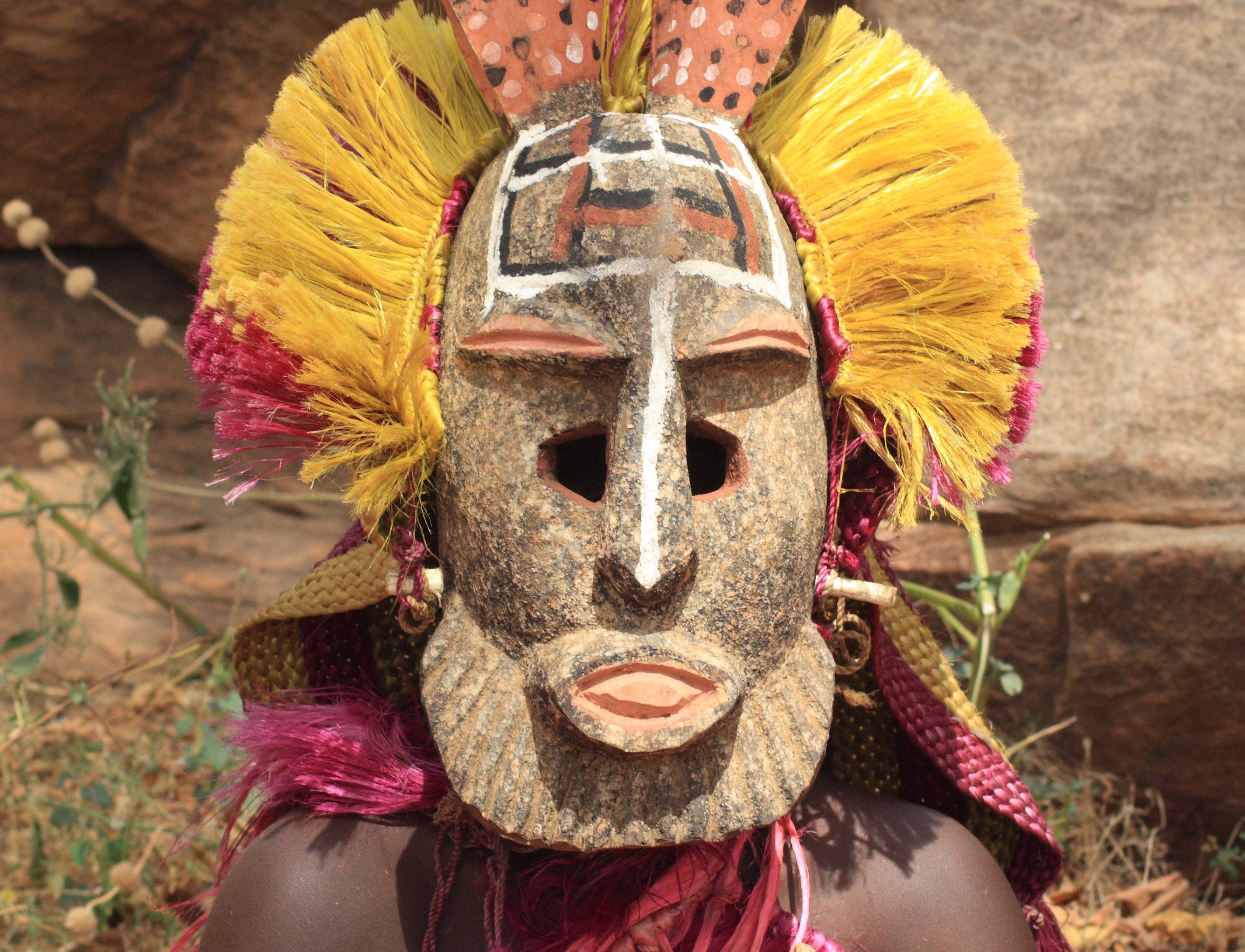 Dogon man with his traditional mask