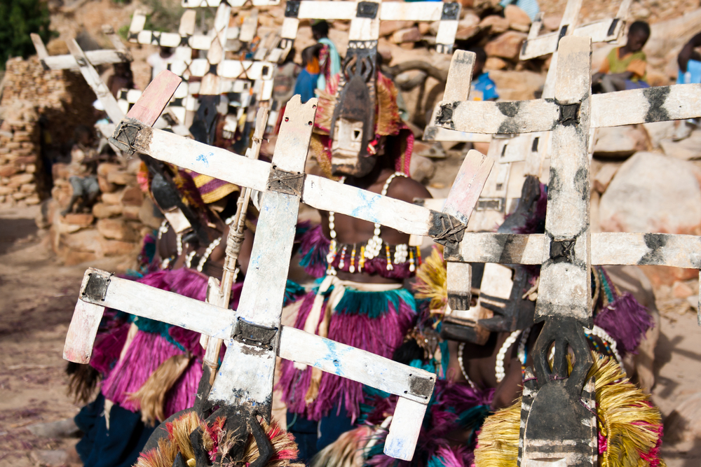 Dogon tribes men dancing with their traditional mask