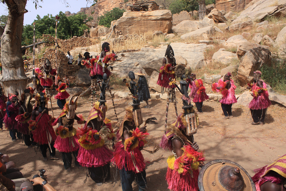 Dogon tribes men dancing with their traditional mask