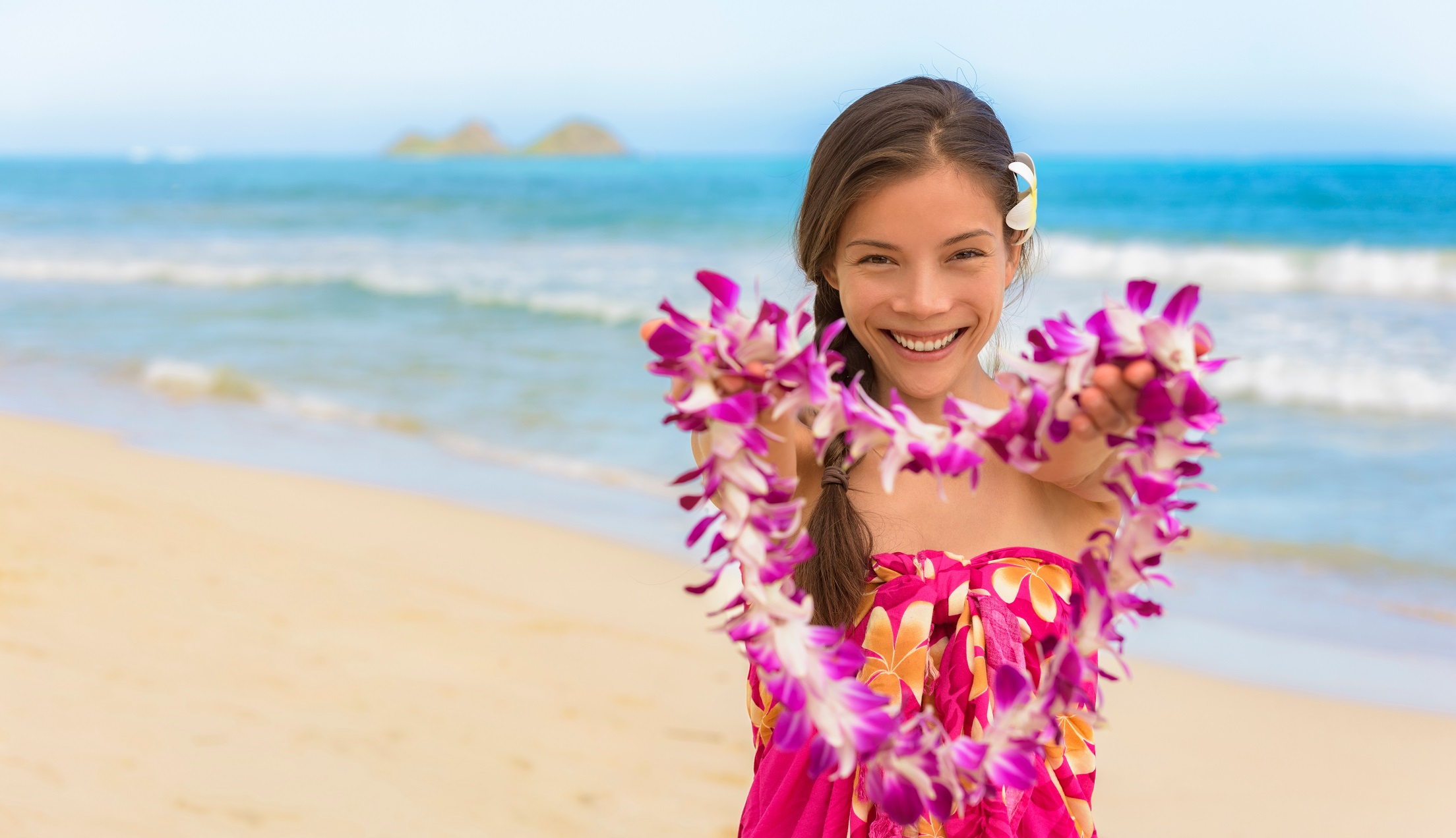 Hawaiian lei girl giving flowers as welcome to Hawaii