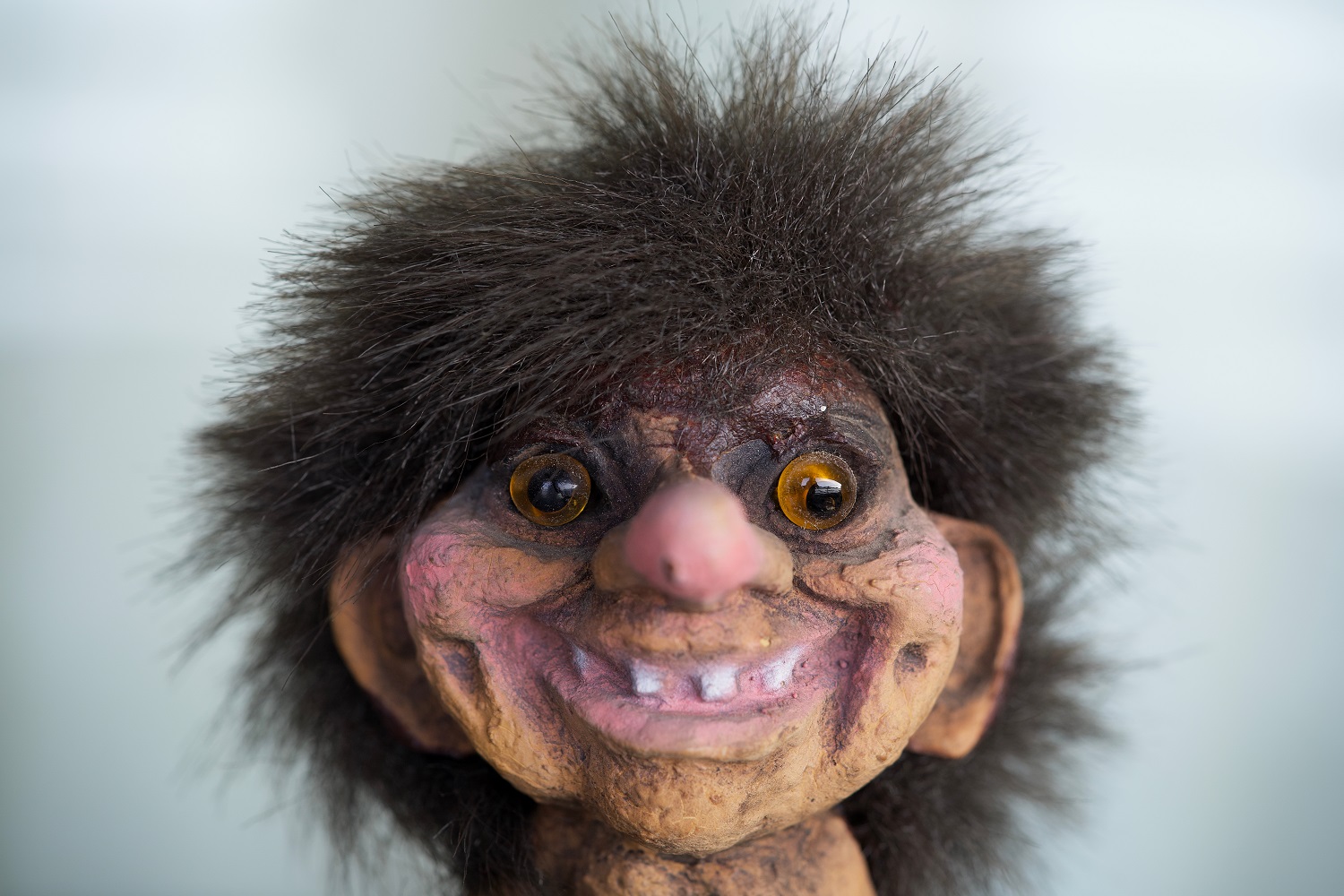 Norwegian troll toy on white background