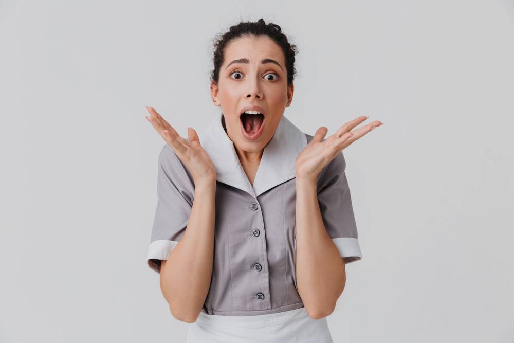 Portrait of a shocked young housemaid