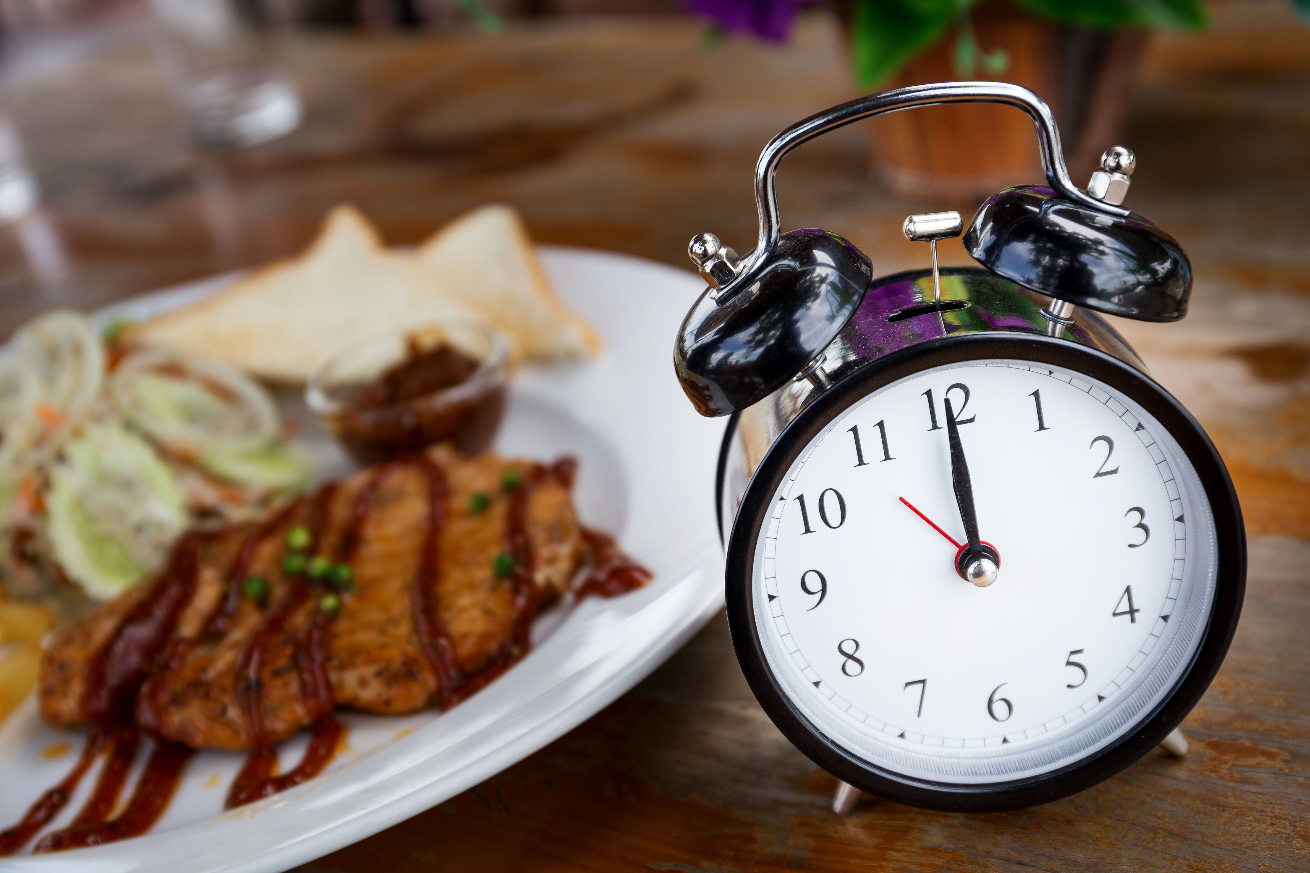Clock in front of lunch dish