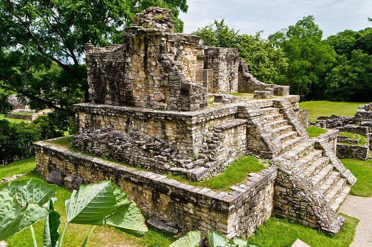 Close-up Photo of a Mayan Temple Surrounded by green trees