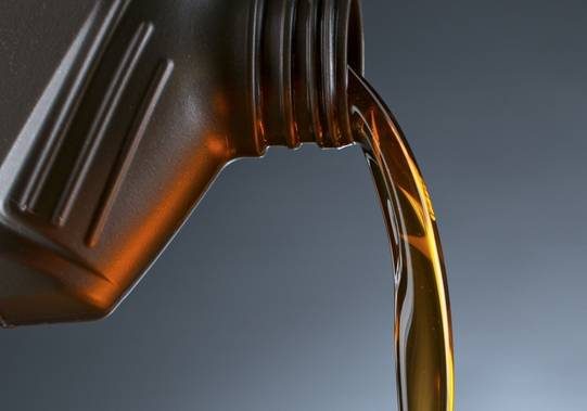 Engine Liquid in Plastic Container