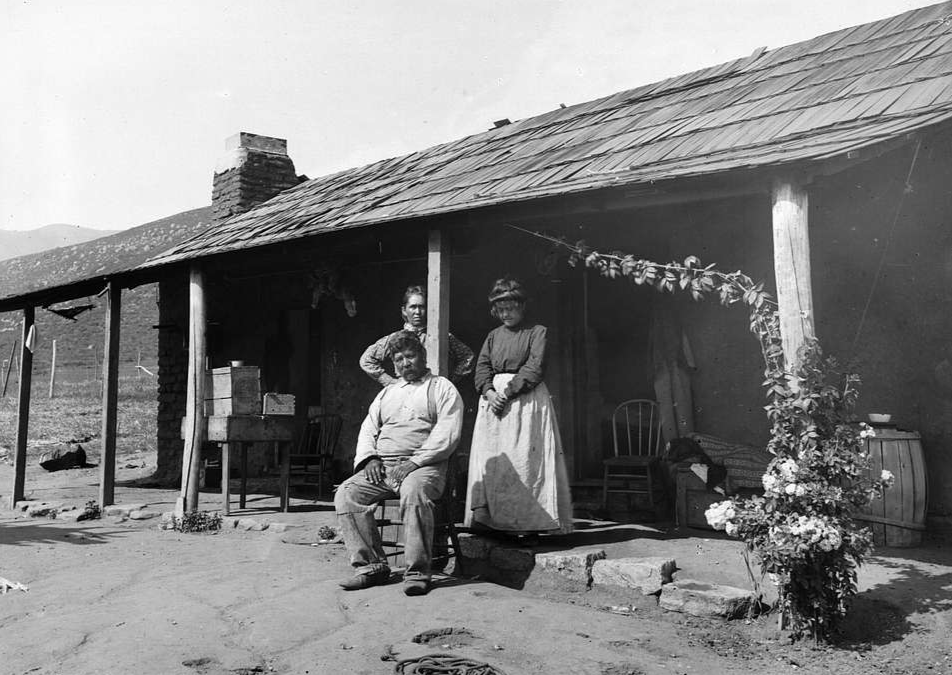 Coahuilla Indian family in front of their house