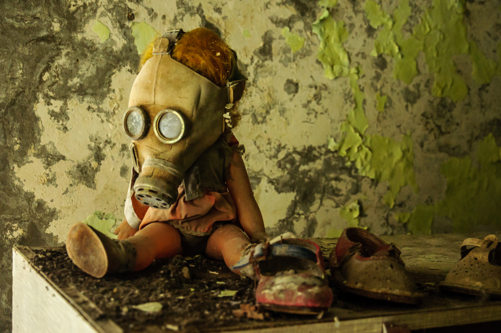 A doll in a gas mask in abandoned city