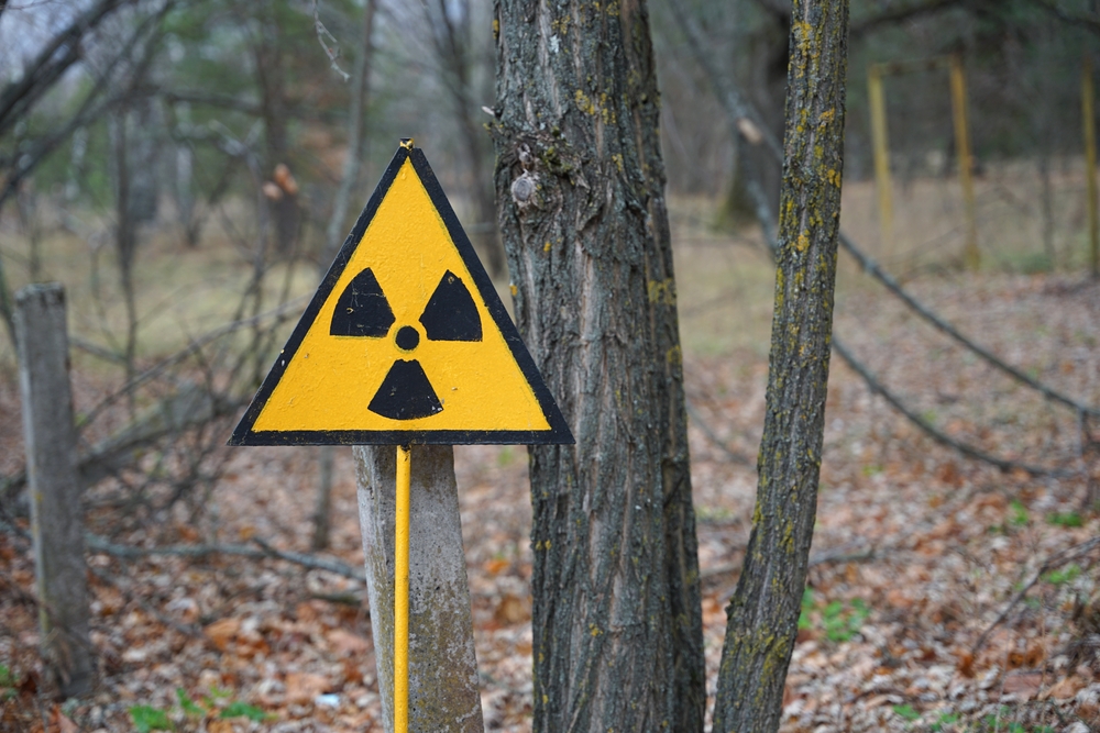 Nuclear radioactive danger sign in forest in Chernobyl