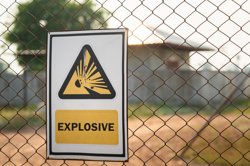 caution information metal sign plate on the wire fence