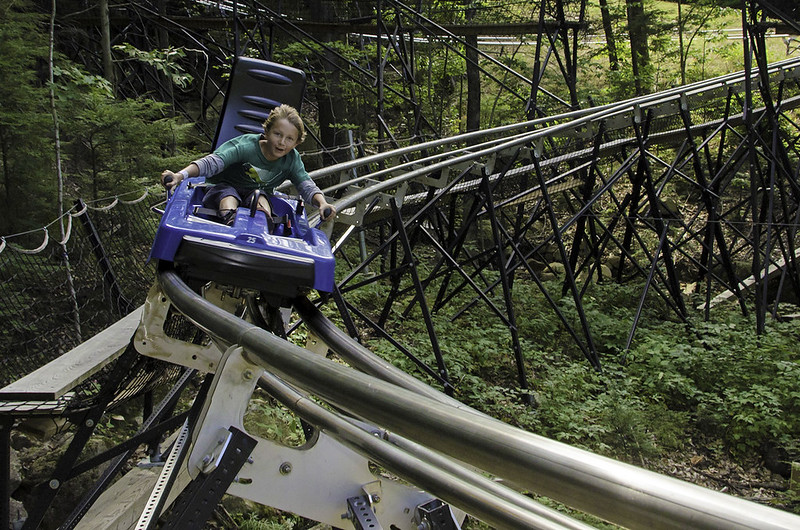 Boy having a ride on a Mountain Roller Coaster