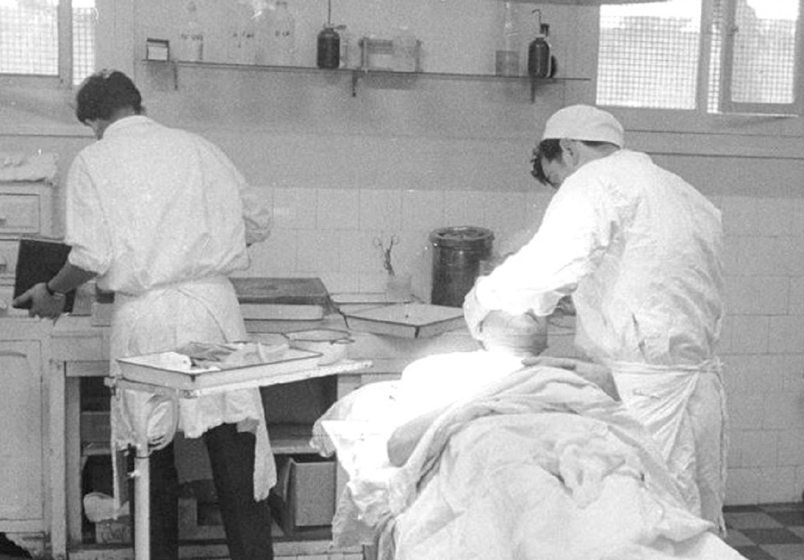 Doctor Treating Patient Inside An Operating Room.