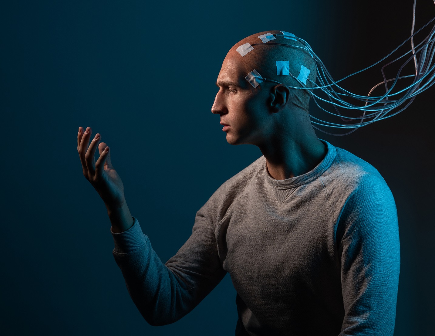 A bald man with electrodes in his brain