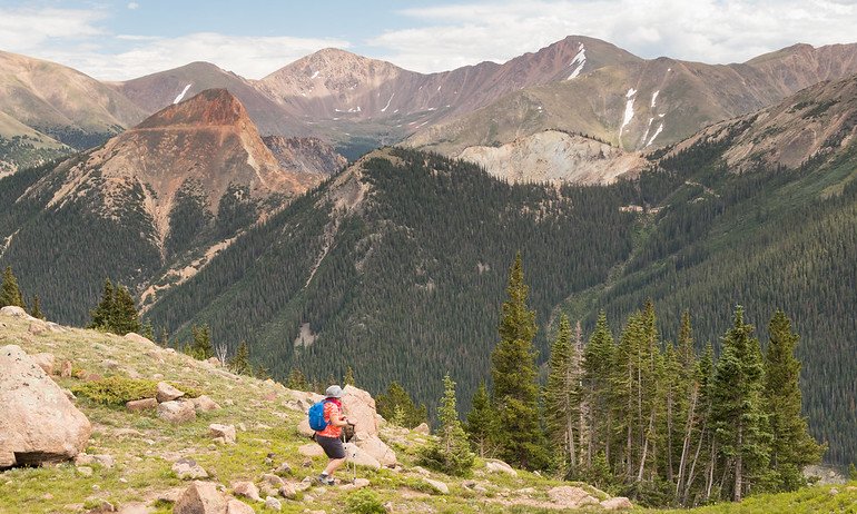Hiker at Vasquez Peak Wilderness, over Henderson Mine