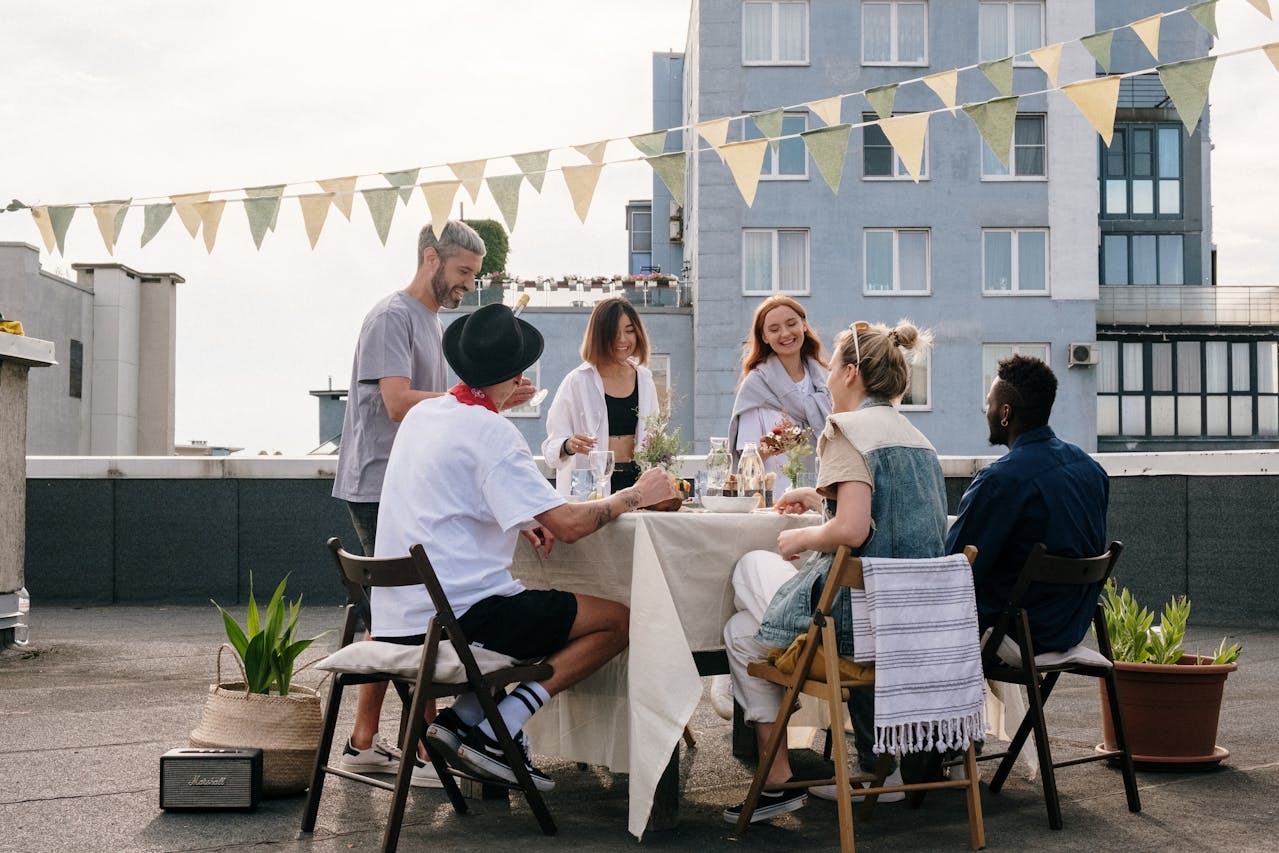 People Sitting on Chairs on the balcony