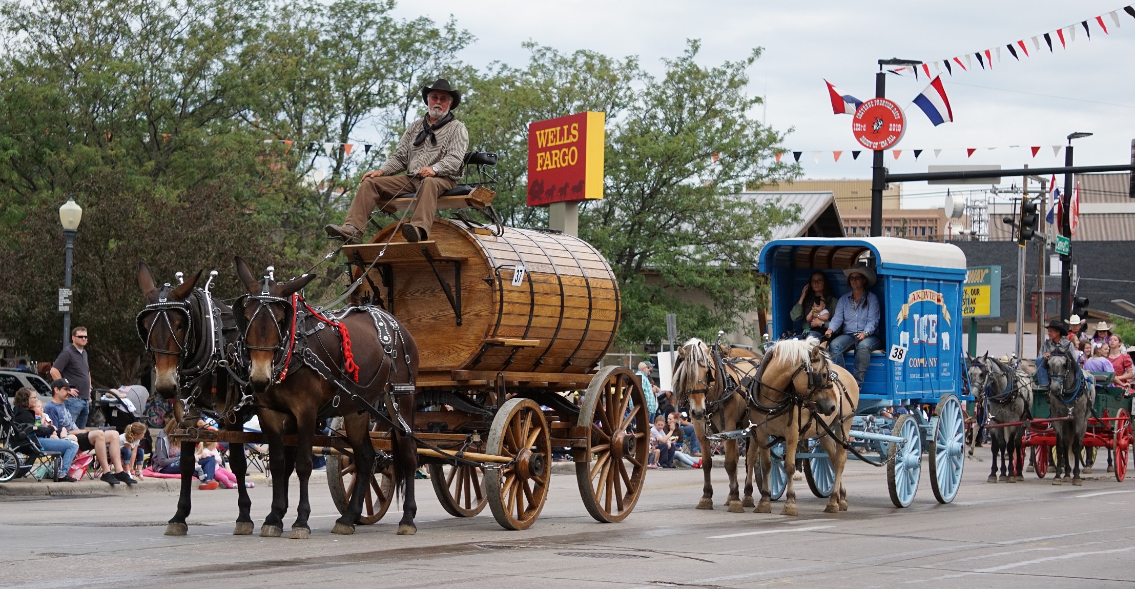 Several wagon and carriage entries in a Cheyenne Frontier Days parade - 2019