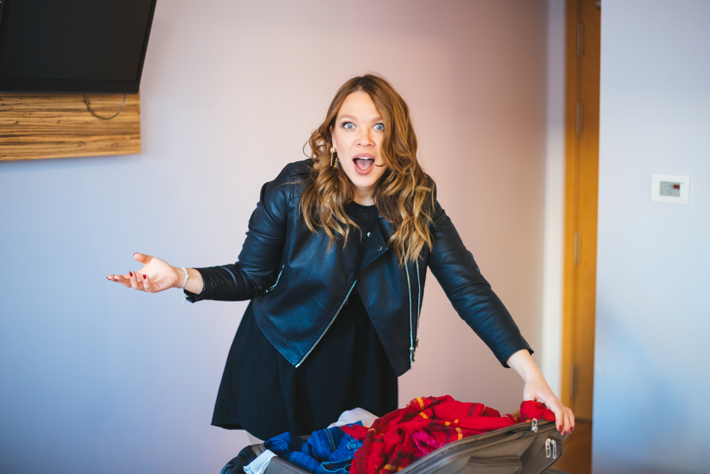 Shocked woman in hotel room