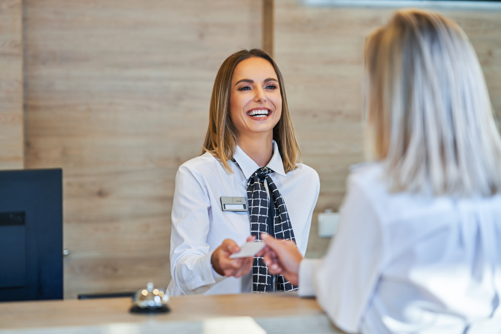 woman checking in a hotel